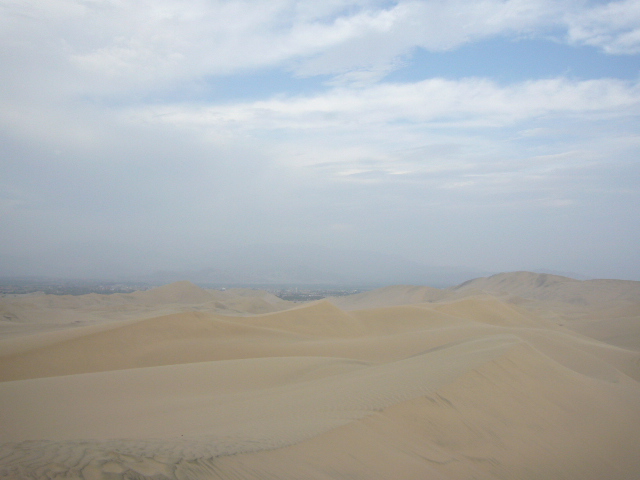The desert, the dirt and the city in the distance